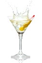 Olive splashing on martini glass on white
