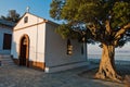 Olive tree and the church of Agios Ioannis Kastri at sunset, famous from Mamma Mia movie scenes, Skopelos Island