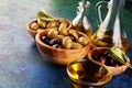 Olives. Bottle virgin olive oil and oil in a bowl with some green and black olives Royalty Free Stock Photo
