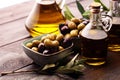 Olives. Bottle virgin olive oil and oil in a bowl with some olives Royalty Free Stock Photo