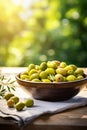 Olives in a bowl against the backdrop of the garden. Selective focus. Royalty Free Stock Photo