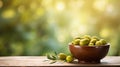 Olives in a bowl against the backdrop of the garden. Selective focus. Royalty Free Stock Photo