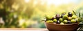 Olives in a bowl against the backdrop of the garden. Selective focus. Royalty Free Stock Photo