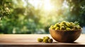 Olives in a bowl against the backdrop of the garden. Selective focus. Royalty Free Stock Photo