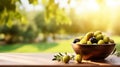 Olives in a bowl against the backdrop of the garden. Selective focus. Royalty Free Stock Photo