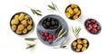 Olives flat lay panorama, top shot on a white background. Black, green and brown olives