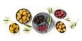 Olives flat lay panorama on a white background, top shot. Black, green and red olives