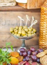 Olives and fruits on a beautifully vintage decorated table Royalty Free Stock Photo