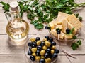 Green parsley, olives, olives, cheese, butter, canapÃÂ©s on a woo Royalty Free Stock Photo
