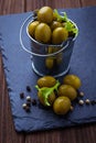 Olives in iron bucket Royalty Free Stock Photo