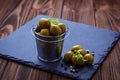 Olives in iron bucket Royalty Free Stock Photo