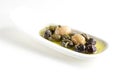 Olives, oil and spice on white plate Royalty Free Stock Photo