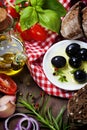 Olives and Olive Oil on an old tablel Royalty Free Stock Photo