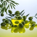 Olives and olive oil and olive leaves floating on a green background Royalty Free Stock Photo