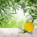 Olives and olive oil on white wooden board and abstract bokeh Royalty Free Stock Photo