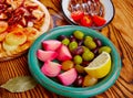 Olives onion pickles tapas anchovies and octopus Royalty Free Stock Photo