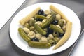 Olives, pickled cucumber, mushrooms and corn in a salad on a plate. food and vegetables. diet and weight loss Royalty Free Stock Photo