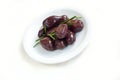 Olives with rosemary on white plate Royalty Free Stock Photo