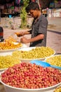 Olives seller at market. Skoura. Morocco