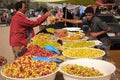 Olives seller at market. Skoura. Morocco