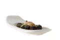 Olives & spice on white plate Royalty Free Stock Photo