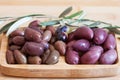 Olives on wooden background, kalamata, kalamon, green olives