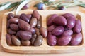 Olives on wooden background, kalamata, kalamon, green olives