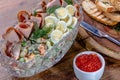 Olivier. Traditional Russian salad of boiled vegetables with meat and mayonnaise in a large salad bowl Royalty Free Stock Photo