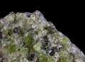 Olivine peridot extreme macro close-up against black background Royalty Free Stock Photo