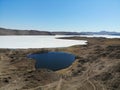 Olkhon Island in spring. Beautiful aerial view of the frozen bay of Lake Baikal and Lake Nuku Nur