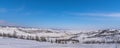 Olkhon island winter landscape. View of the mountains, frozen Lake Baikal and the federal highway Irkutsk-Khuzhir on a cloudy day Royalty Free Stock Photo
