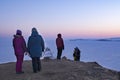 Olkhon, Siberia, Russia- February 23, 2023 : People meet the sunrise on Shamanka. Olkhon island on winter Baikal lake at Royalty Free Stock Photo