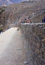 Ollantaytambo/Peru - Oct.02.19: tourists climbing the stairs of archaeological park, on the Sacred valley of incas