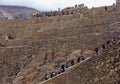 Ollantaytambo/Peru - Oct.02.19: tourists climbing the stairs of archaeological park, on the Sacred valley of incas