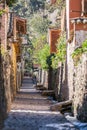 Ollantaytambo, Urubamba/Peru - circa June 2015: Old narrow street and brick buildings in Ollantaytambo Inca town Royalty Free Stock Photo