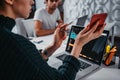 Team of business man and woman managers sitting at desktop and monitoring statistics on screen laptop Royalty Free Stock Photo