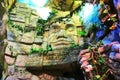 Olmec sculpture carved from stone. Mayan symbol - Big stone head statue in a jungle