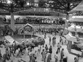 Grey shaded - Overall view on the interior of Malay themed pavilion at Flora Exposition. Pool and many tourists visible