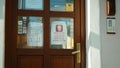 OLOMOUC, CZECH REPUBLIC, APRIL 20, 2020: Entry Czech Post branch door, banner respecting government`s ban movement