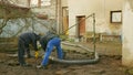 OLOMOUC, CZECH REPUBLIC, DECEMBER, 30, 2019: Septic cesspool emptying pumping into pipe tank suction hose under high