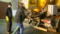 OLOMOUC, CZECH REPUBLIC, DECEMBER, 30, 2019: Septic cesspool emptying pumping into pipe tank truck suction hose under Royalty Free Stock Photo