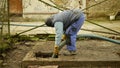 OLOMOUC, CZECH REPUBLIC, JANUARY, 20, 2021: Cesspool septic emptying pumping into pipe tank truck suction hose under Royalty Free Stock Photo