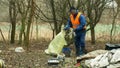OLOMOUC, CZECH REPUBLIC, JANUARY 2, 2019: Man collect garbage rubbish gathers bag, forest landscape in endangered nature