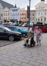 Olomouc, Czech Republic Ã¢â¬â July 17, 2021: Disabled man on wheel chair and his wife as an assistant