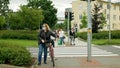 OLOMOUC, CZECH REPUBLIC, JUNE 22, 2020: Coronavirus mask face turning over people crowd women traffic lights pedestrian