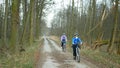 OLOMOUC, CZECH REPUBLIC, MARCH 13, 2020: Face masks coronavirus risk covid-19 family children on bike trip on bikes