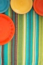 ÃÂ¡olored plates on the striped green cloth, blanket Royalty Free Stock Photo