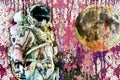 Olorful artistic astronaut in costume standing near car loaded with things on background of moon and bright paint splatters