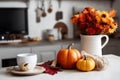 olorful autumn composition, bouquet of leaves and pumpkin in a vase on kitchen table. Royalty Free Stock Photo