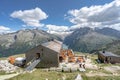 Olpererhutte, Austria - Aug 7, 2020: Tourists have food at wooden restaurant hostel